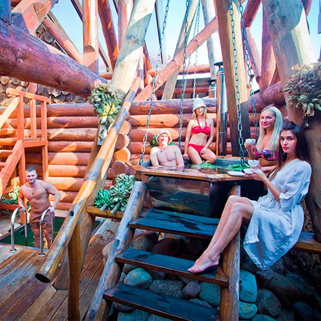 company is resting and steaming in outdoor spa tubs