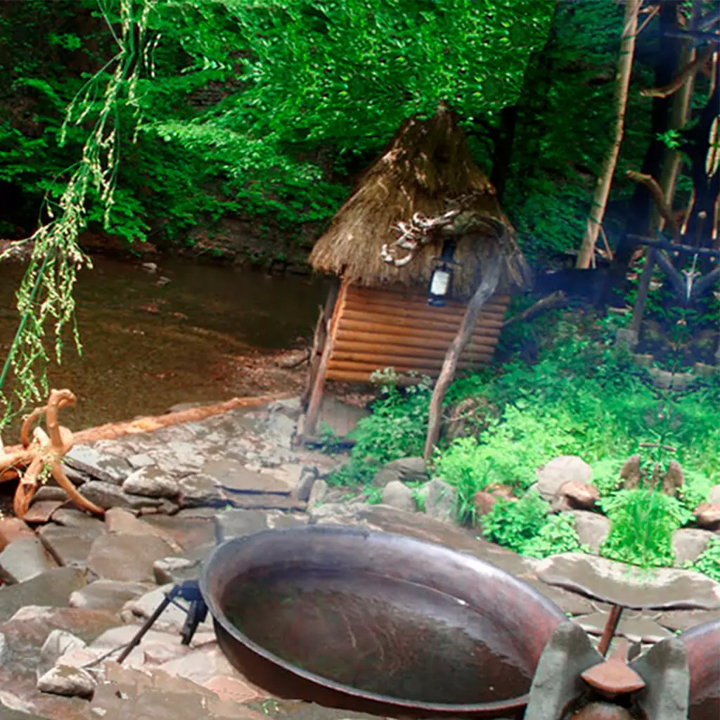 ethnic hot tube bath on the mountain river bank