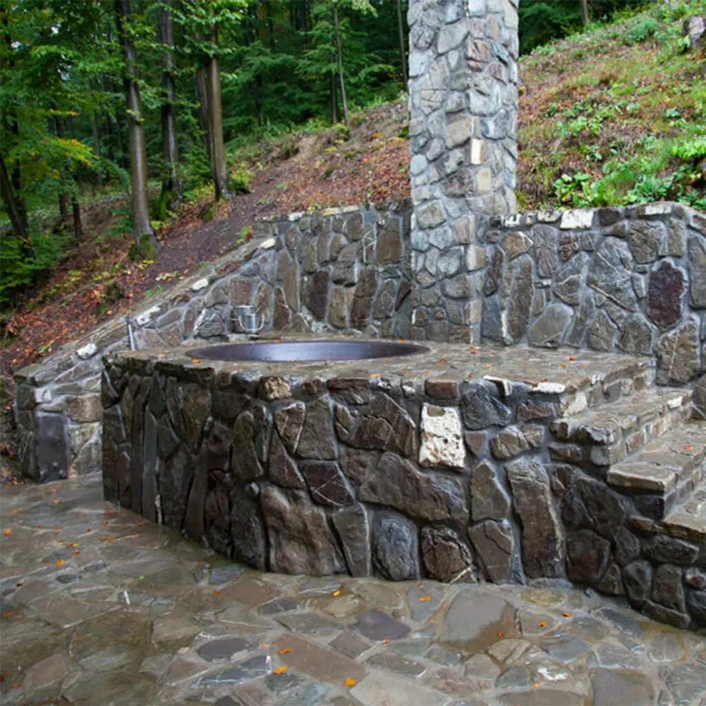 hot spa iron tub in a forest estate