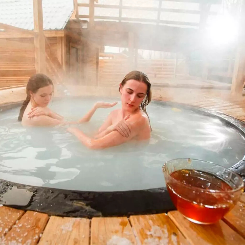 mother and dother in milky stainless steel hot tub