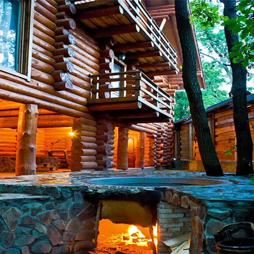 outdoor bathtub with a burning fire in the manor