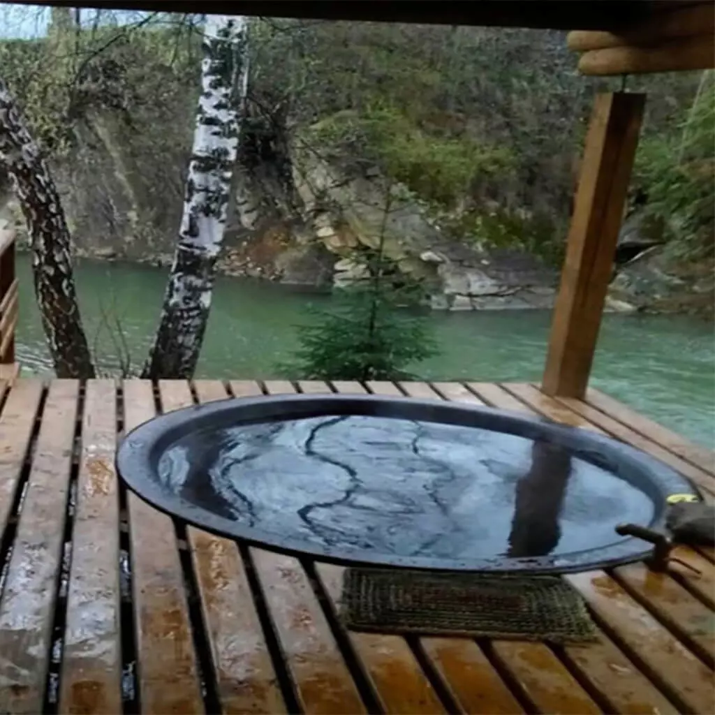 outdoor home made hot tub at the mountain river bank