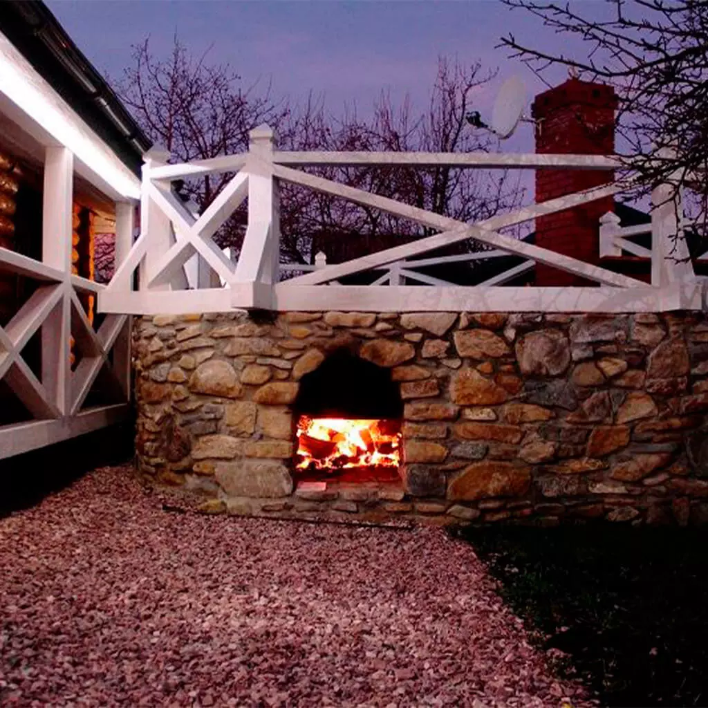 outdoor hot tub installation with fire in evening